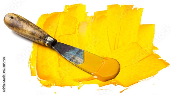 Obraz Yellow printing press color with spatula isolated on white.
