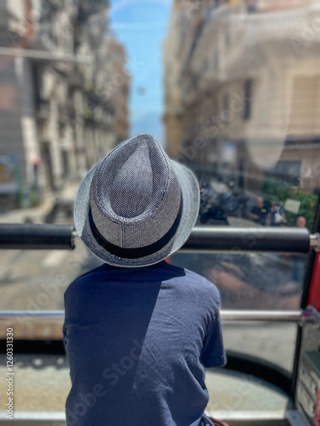 Obraz A young boy is enjoying a beautiful and scenic view while on an exciting bus tour