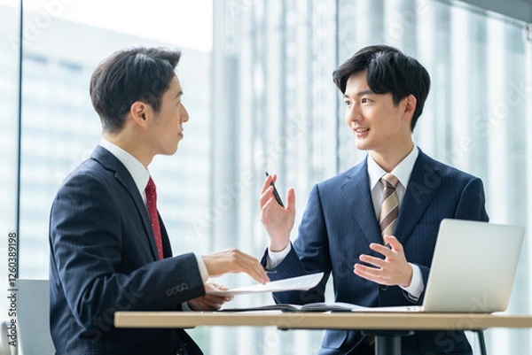 Obraz オフィスで営業をする若いビジネスマン　撮影協力:スカパー東京メディアセンター