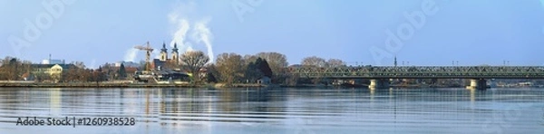 Fototapeta Panoramic image of the river Danube with bridges and the city of Tulln in the background on a sunny snowless winter day in Austria
