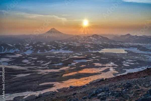 Fototapeta Sunrise from the top of Gorely volcano and view to Vilyuchinsky volcano in Kamchatka Peninsula in Russia.