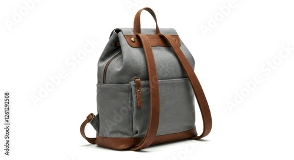 Fototapeta A classic gray canvas backpack with vintage-inspired brown leather straps on a neutral white background.