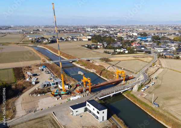 Fototapeta 道路拡張のための橋の架け替え工事　新しい橋の建設工事風景空撮