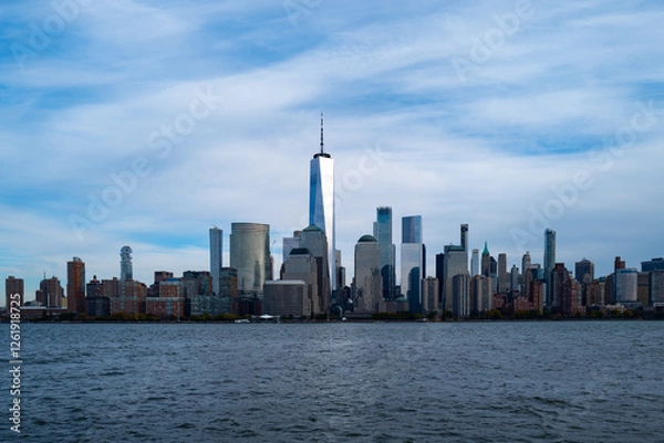 Fototapeta New York City cloudy skyline. NYC skyscrapers. Manhattan. NY cityscape with clouds. Downtown New York buildings. NYC skyline. New York harbor view. Skyscrapers in Manhattan. NYC downtown.