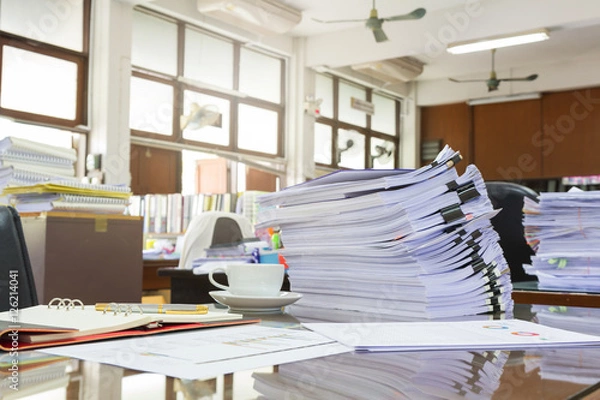 Fototapeta Business Concept, Pile of unfinished business documents on office desk, Stack of business paper