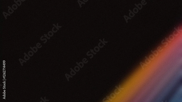 Obraz Diagonal gradient light streak in red, orange, and blue on a dark background. Ideal for wallpapers and modern designs.