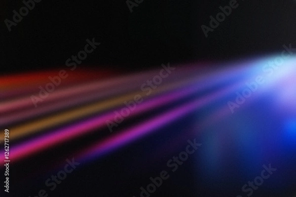 Obraz An abstract background featuring soft, colorful light streaks in red, purple, orange, and blue against a dark backdrop. The dreamy, futuristic glow makes it ideal for wallpapers, creative designs.