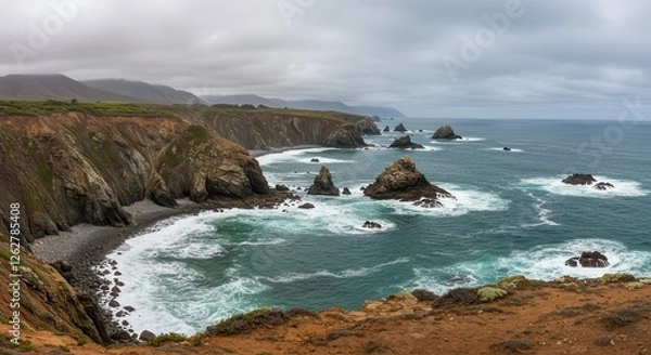 Fototapeta Dramatic Ocean Coastline with Sea Stacks and Waves Under Cloudy Sky