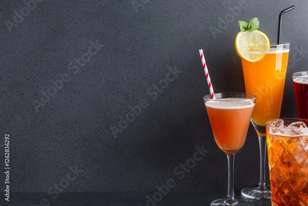 Fototapeta Refreshing drinks and beverages, cold and enticing on simple dark background