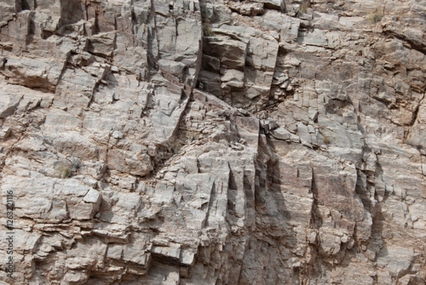 Fototapeta Closeup of brown rough stone and shale in the Sonoran desert