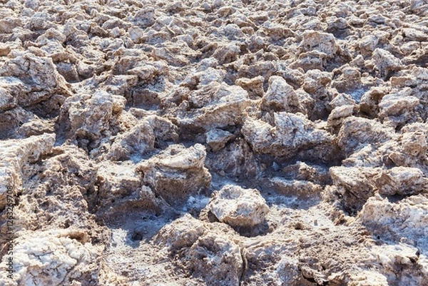 Fototapeta Death Valley National Park's Devil's Golf Course is comprised of salt that's been crystalized into rough and sharp formations