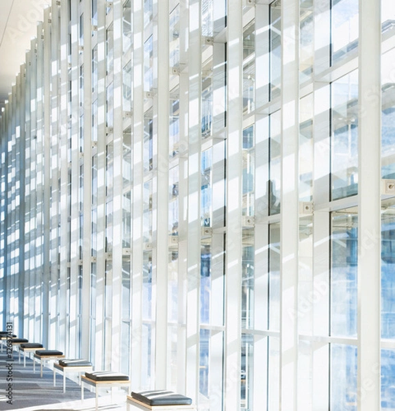 Obraz Glass wall in the office building. Modern sunny empty loft room