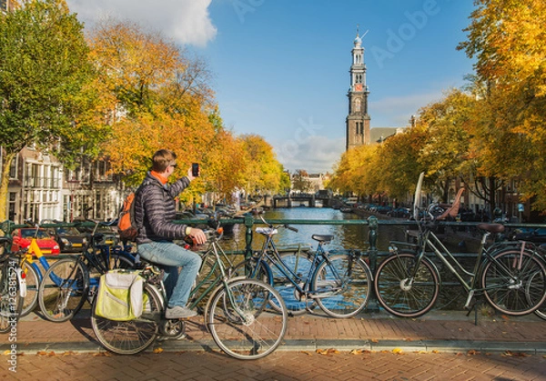 Fototapeta Tourist taking photo of Westerkerk