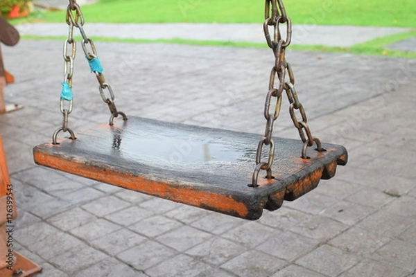 Obraz Old wooden swing in playground, close up
