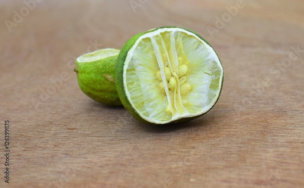 Obraz Dried lime / lemon on wooden background