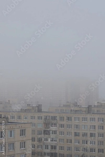 Fototapeta Urban foggy landscape with old multi-storey panel houses vertical orientation