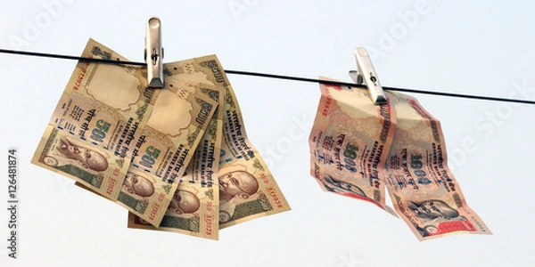 Obraz Ban on Rs 500, Rs 1000 notes is surgical strike on terror funding, black money. Now these are only few colorful paper. It has no value in India. Waiting for rebirth. Hanging in the air.