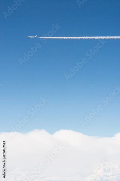 Obraz Airplane flying in blue sky