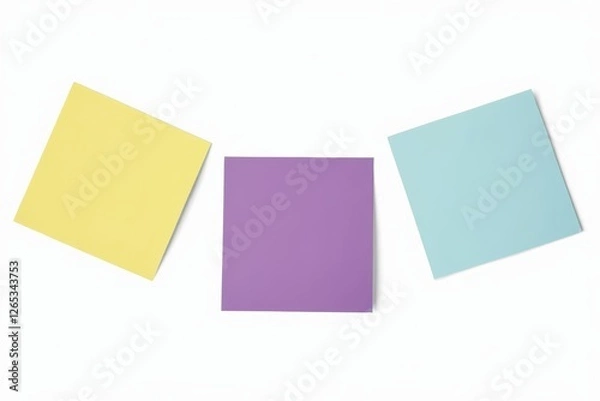 Fototapeta three pieces of paper are arranged on a white surface