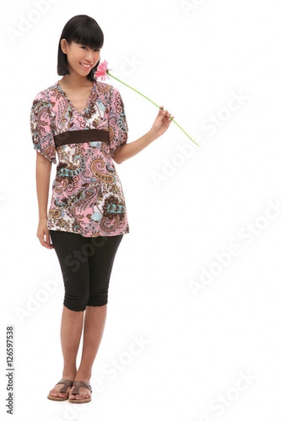 Fototapeta Young woman holding flower