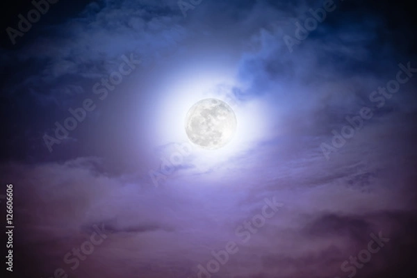 Fototapeta Attractive photo of a nighttime sky with clouds and bright full moon. Nightly sky with beautiful full moon. Outdoors at night. The moon were NOT furnished by NASA.