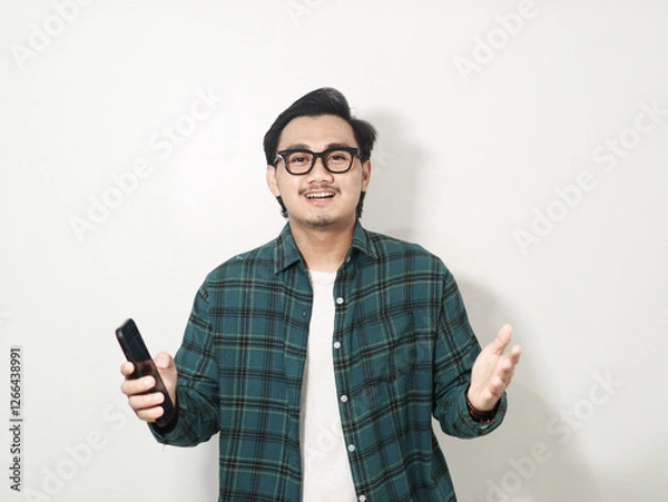Obraz Adult Asian man showing cheerful face expression with both hands open isolated on white background