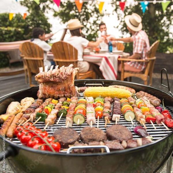 Obraz Family having a barbecue party in their garden