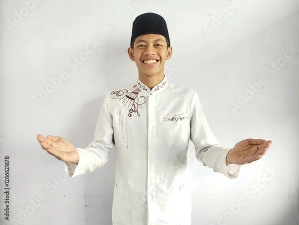 Fototapeta Moslem Asian man smiling at the camera with arms open doing welcoming gesture