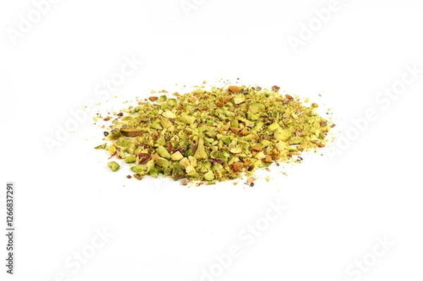Fototapeta Ground, milled, crushed or granulated pistachio pile isolated on white background. Scattered pistachio nut pieces isolated. Break chopped pistachios pile, fried baked diced pistache on white backgroun