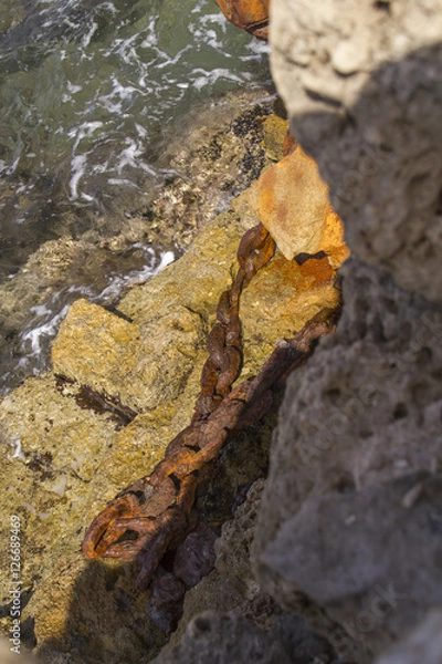 Fototapeta Rustic Chain in Herods Port  ruins in Caesarea. Mediterranean coast of Israel