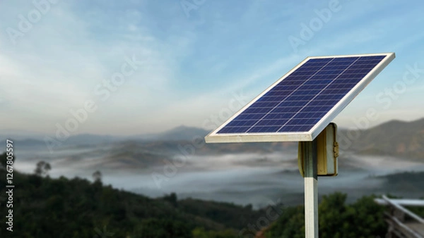 Obraz A solar panel set up in a remote location, providing electricity to homes without access to the main grid.