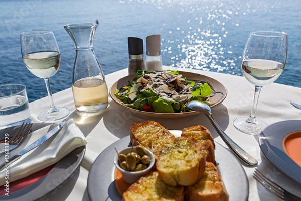 Fototapeta Table with food and wine