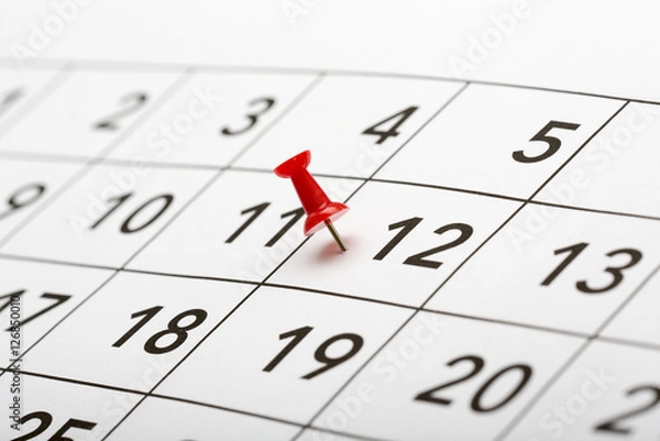 Fototapeta Pin on the date number 12. The twelfth day of the month is marked with a red thumbtack. Focus point on the red pin.