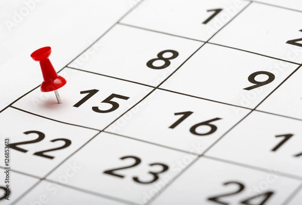Fototapeta Pin on the date number 15. The fifteenth day of the month is marked with a red thumbtack. Focus point on the red pin.
