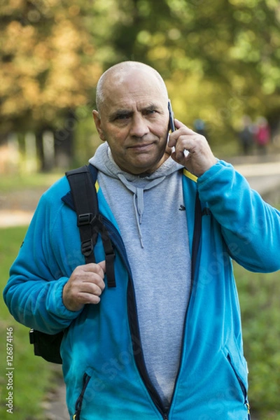 Obraz senior man with mobile