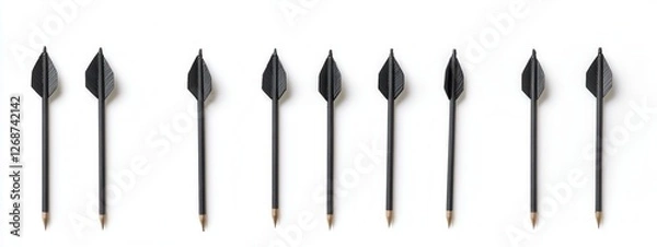 Fototapeta Black Arrow Pencils Arranged in a Line on a White Background for Creative Conceptual Use