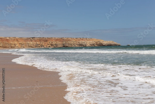 Fototapeta Wave patterns on the shoreline of Maslins nudist beach