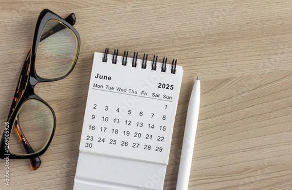 Fototapeta Hello, June. The planning calendar for June 2025 is on your desktop.