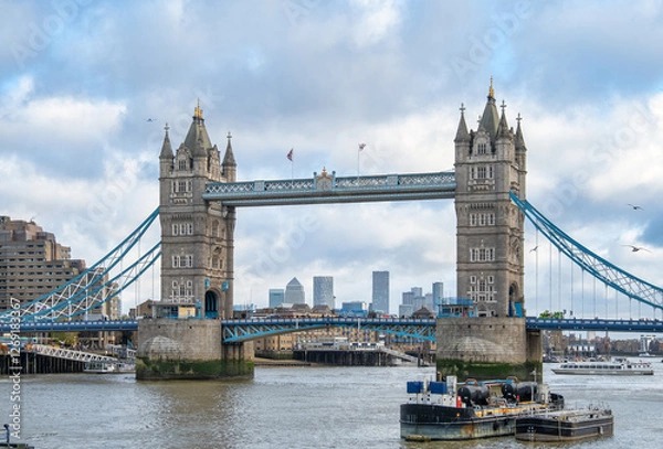 Fototapeta Tower Bridge Over the River Thames with London’s Modern Skyline in the Background