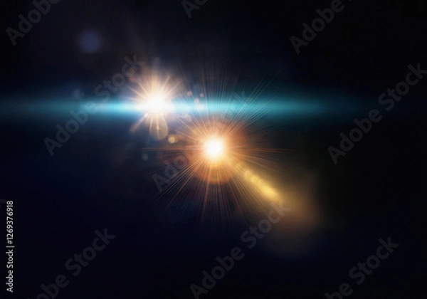 Obraz A bright light flares across a dark background, casting a glow of warm and cool colors.