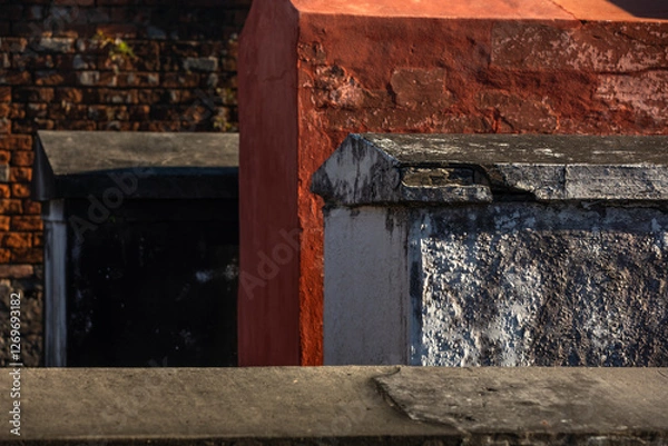Fototapeta Colorful Grave Sites and Mausoleums at St Louis Cemetery No. 1 in New Orleans on a sunny Day; Close-up with Copy Space