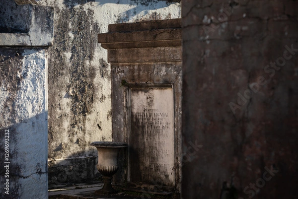 Fototapeta Grave Sites and Mausoleums at St Louis Cemetery No. 1 in New Orleans on a sunny Day; Close-up with Copy Space