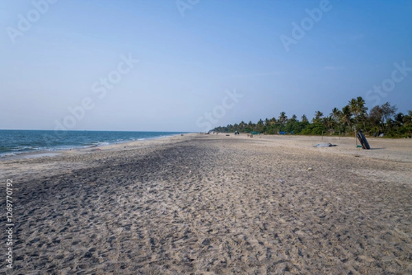 Fototapeta The sandy beach at Alappuzha in Asia, India, Kerala, Alleppey, in summer, on a sunny day.