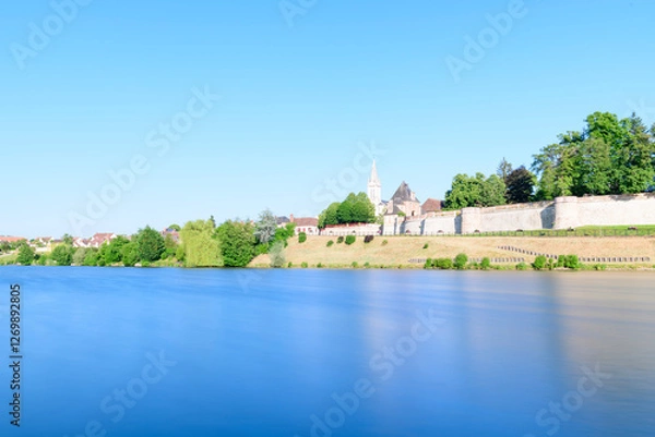 Fototapeta Dampierre-en-Burly view from the pond in Europe, France, Centre Val de Loire, Loiret, Dampierre en Burly, in summer, on a sunny day.