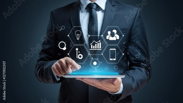 Fototapeta Businessman interacting with digital applications on a tablet device