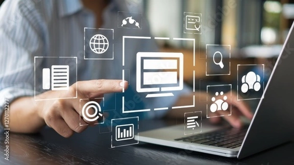 Fototapeta Person uses laptop with graphic business related icons hovering