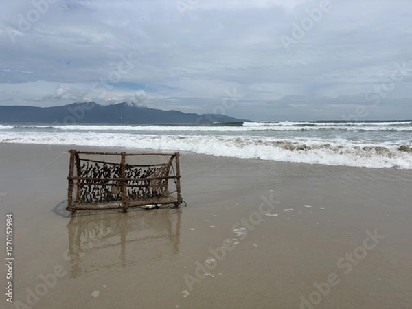 Fototapeta Abandoned fishing cage on the beach in Da Nang Vietnam