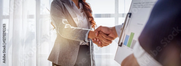 Fototapeta Trusted partner. Businessmen making handshake with partner, Businesswoman handshake and business people. Successful business concept. Banner background, 