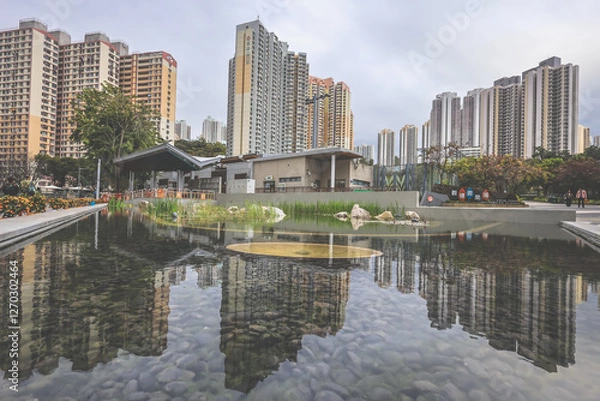 Fototapeta Jan 31 2025 Reflecting High-Rise Residential Buildings in a Calm Pond