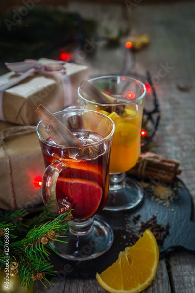 Fototapeta Mulled wine and apple cider in glass cups